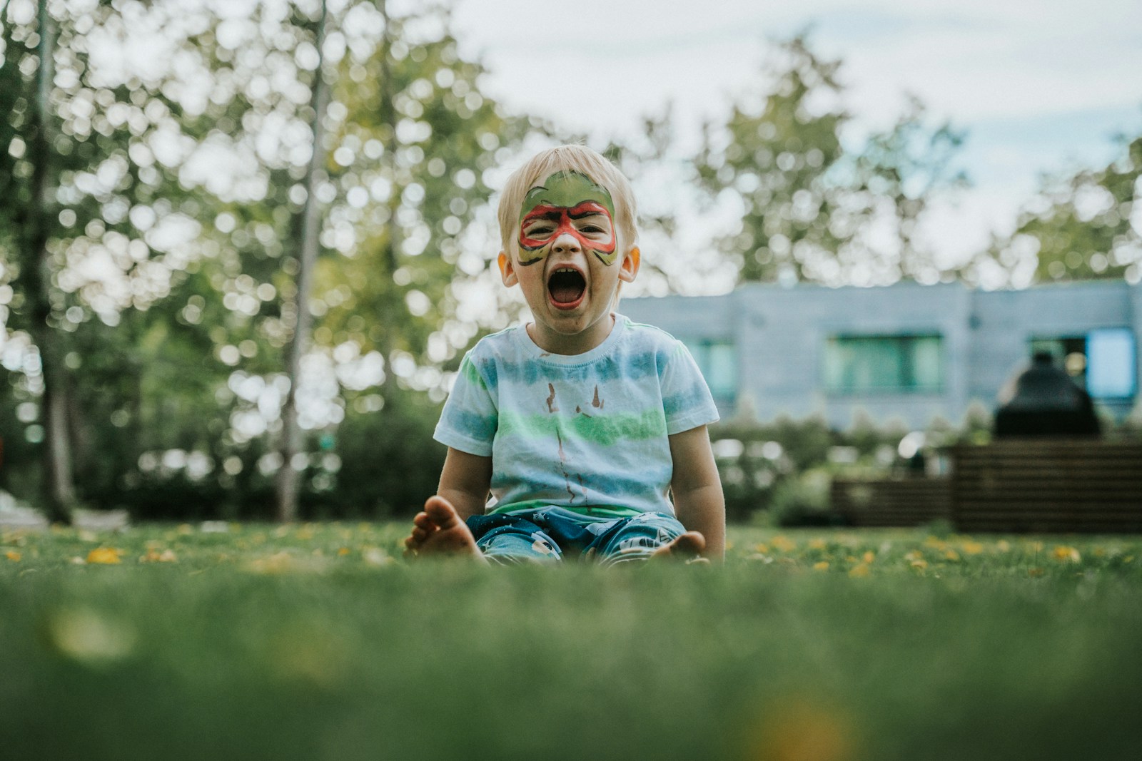 a child running in a grassy area