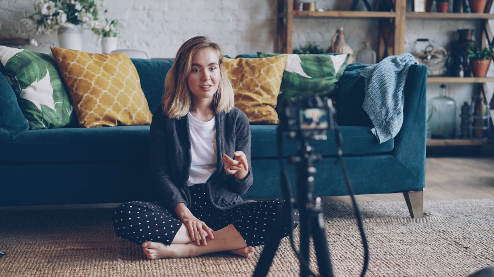 Woman recording video in a living room