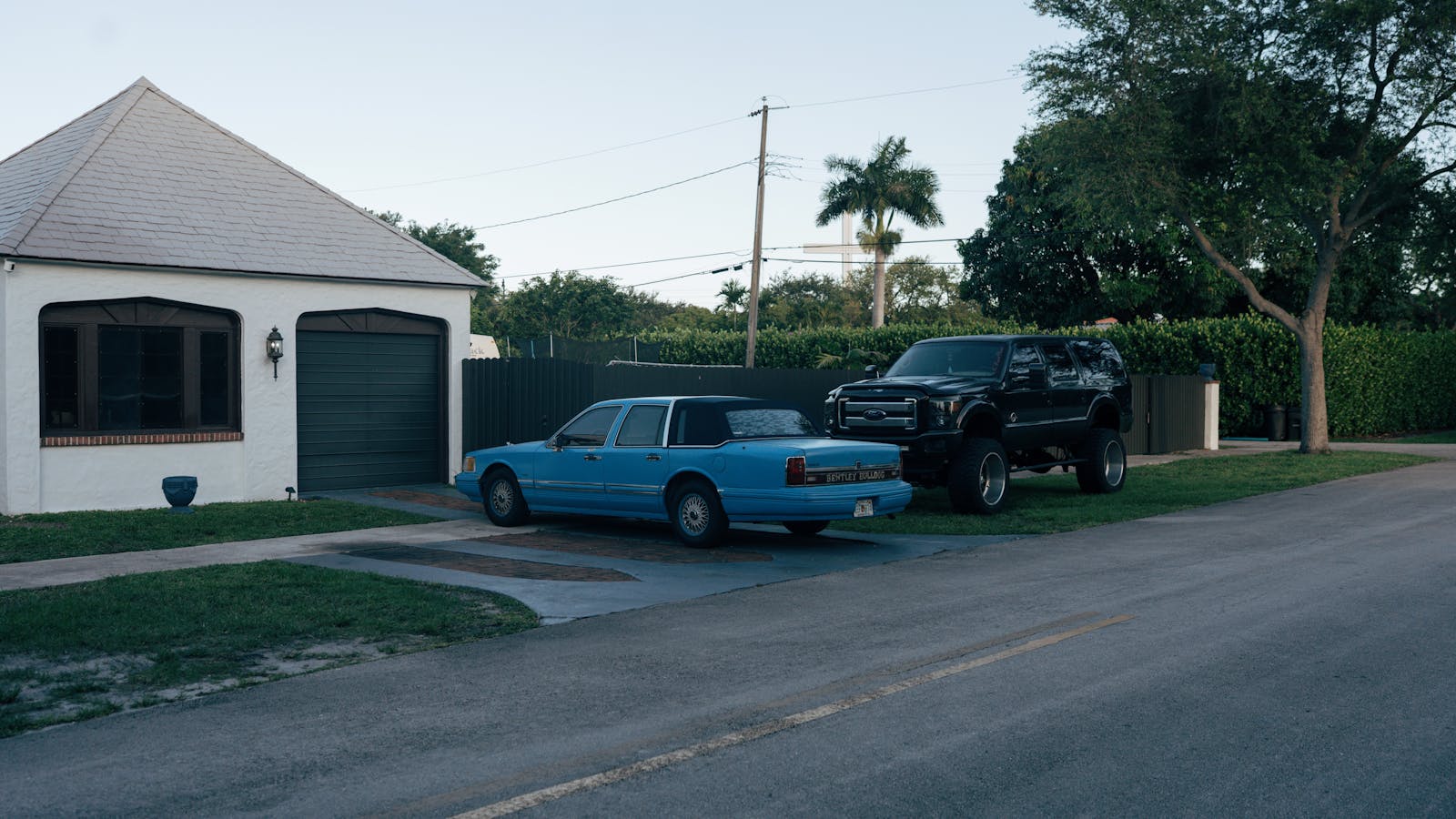 Neighbor Parks In Their Driveway, Blocks Their Usual Curb Spot With A Bucket, And Starts A Petty Parking War He May Not Be Ready For