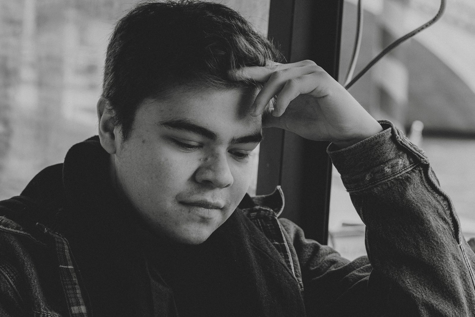 a black and white photo of a young man