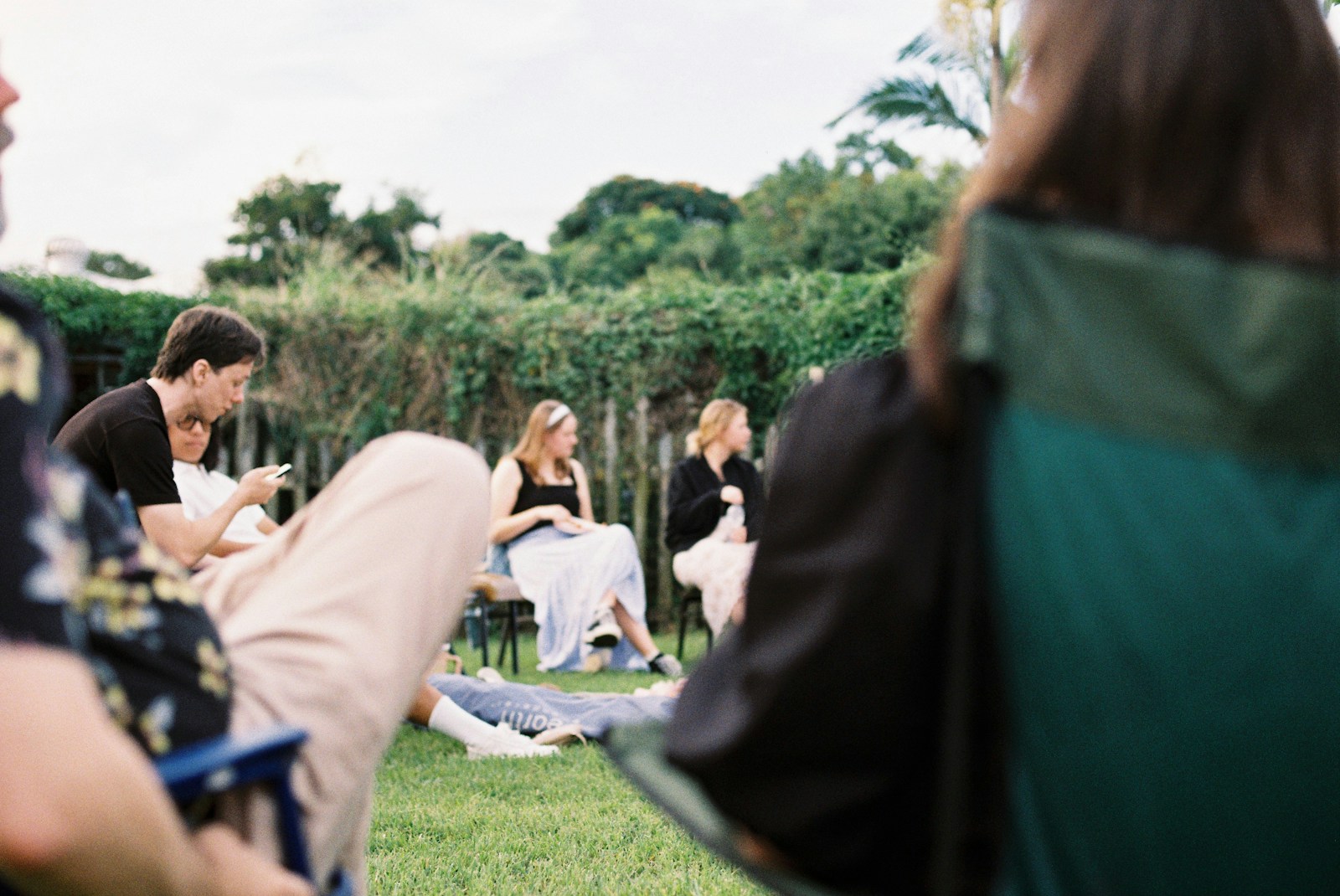 People gathered outdoors on a sunny day.
