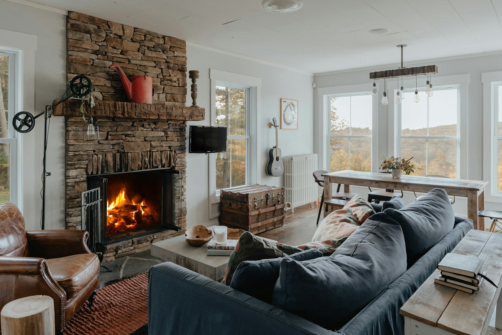 a living room filled with furniture and a fire place