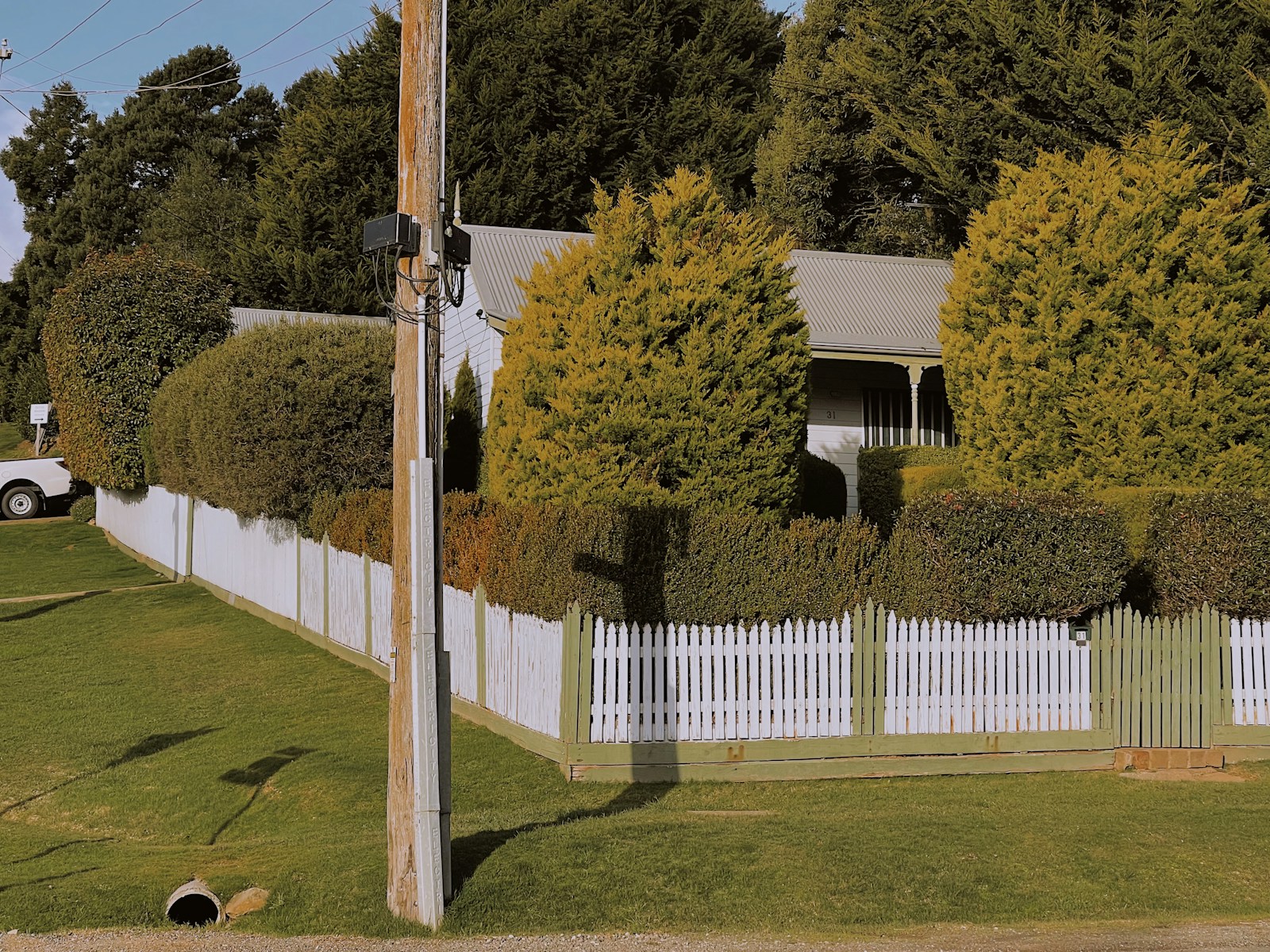 a white picket fence in front of a house