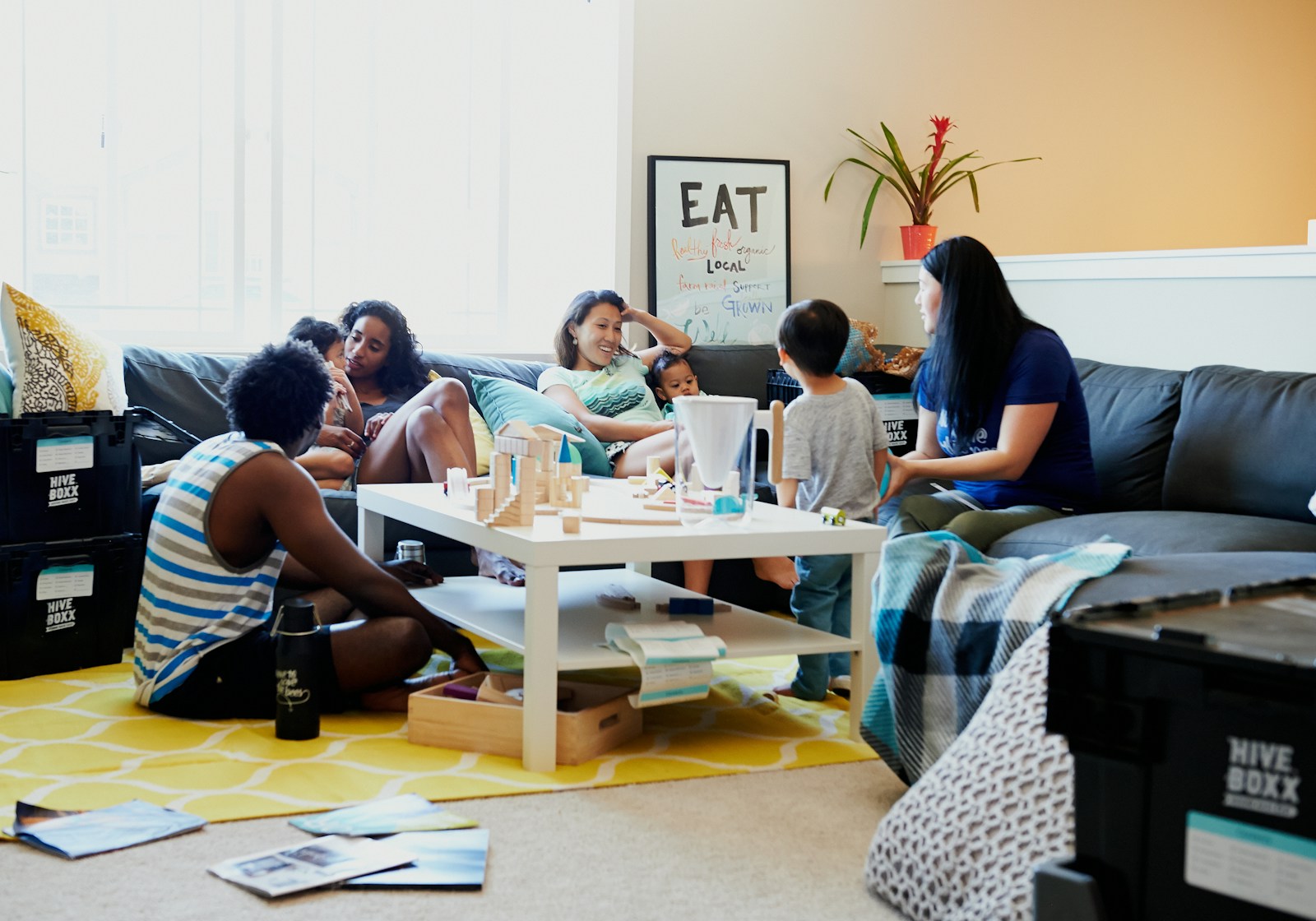 group of people sitting on chair in front of table