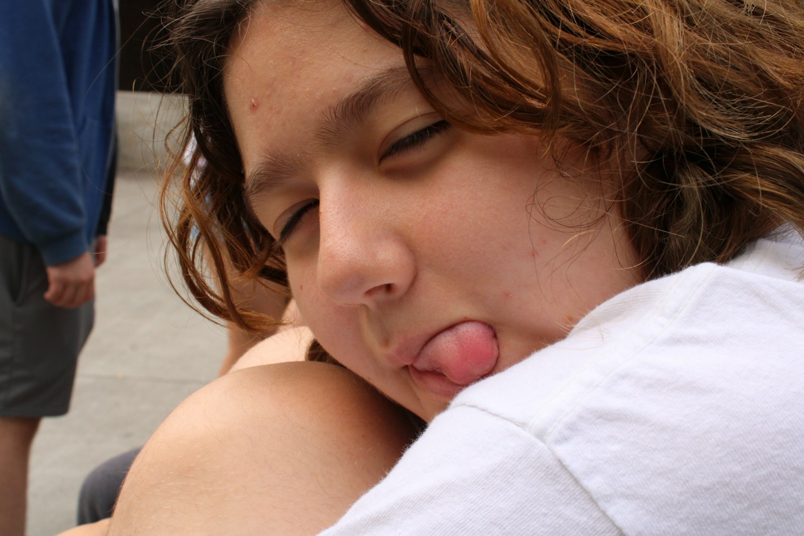 a young girl sticking her tongue out and sticking her tongue out