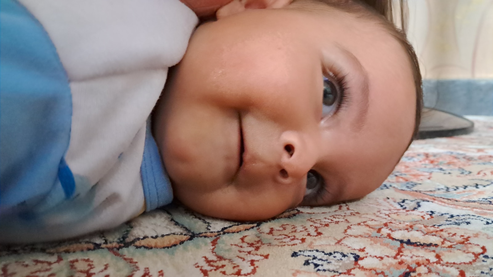 a baby is laying down on a bed