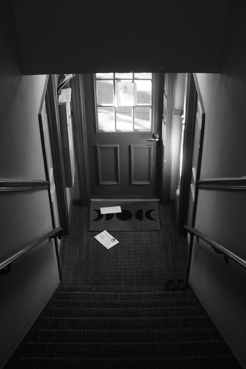 A black and white photo of a hallway