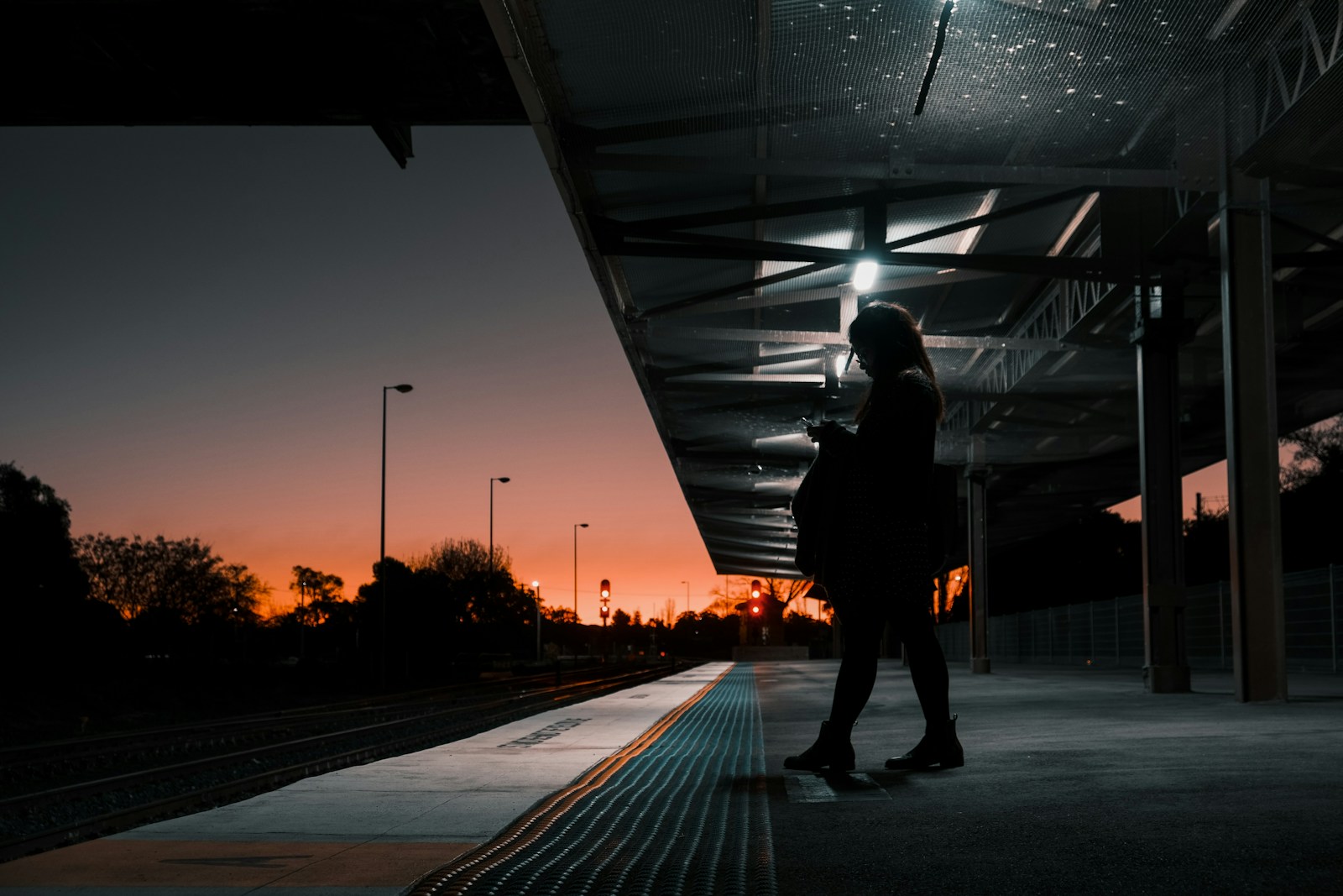 a person standing on a train platform