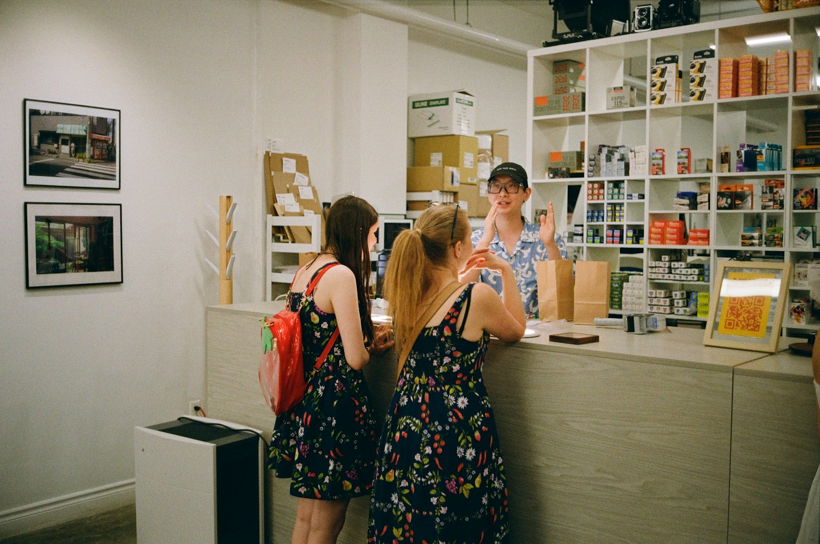 Customers are at the counter, being assisted by an employee.