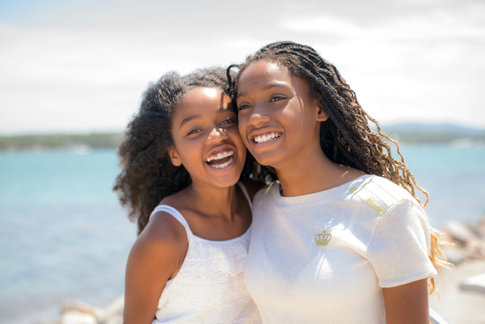 a couple of women smiling at the camera