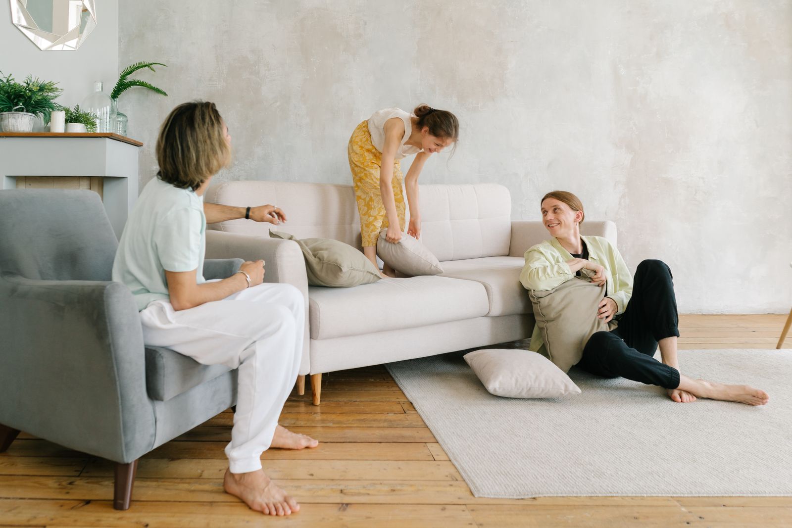 A family enjoying playful times in a chic living room, emphasizing warmth and connection.