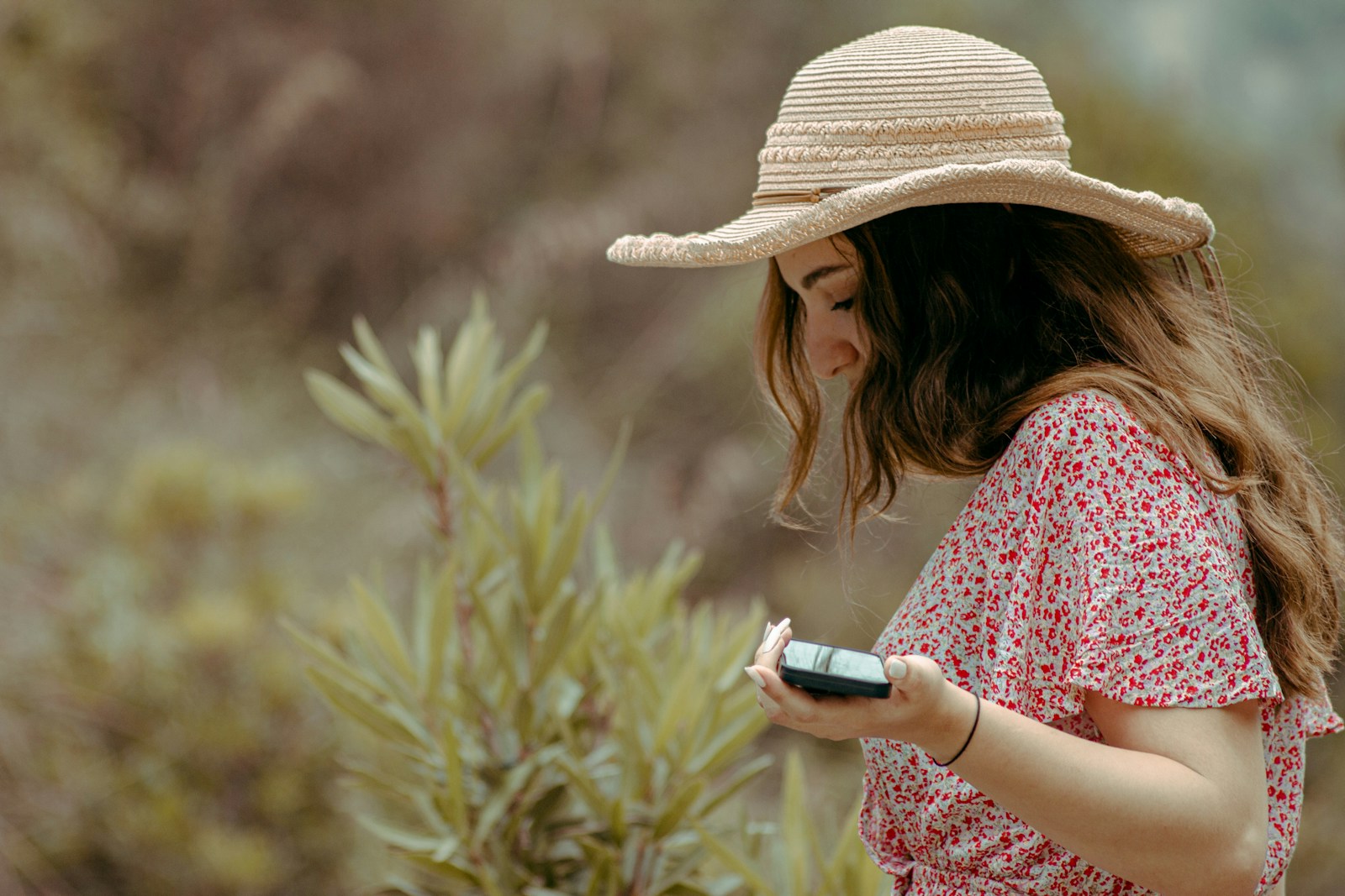 a woman holding a cell phone