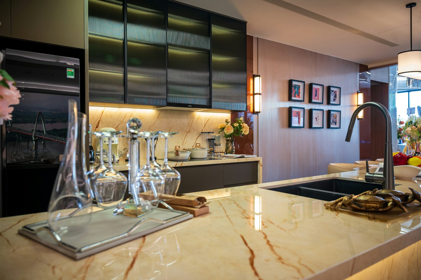 Modern kitchen with marble island and stainless steel cabinets