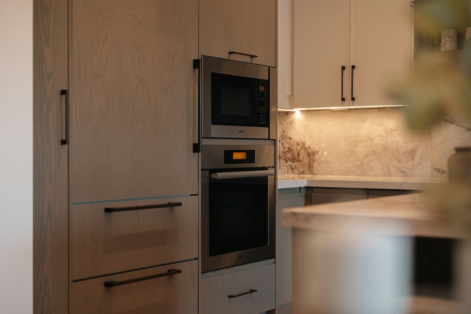 Modern kitchen with built-in oven and microwave