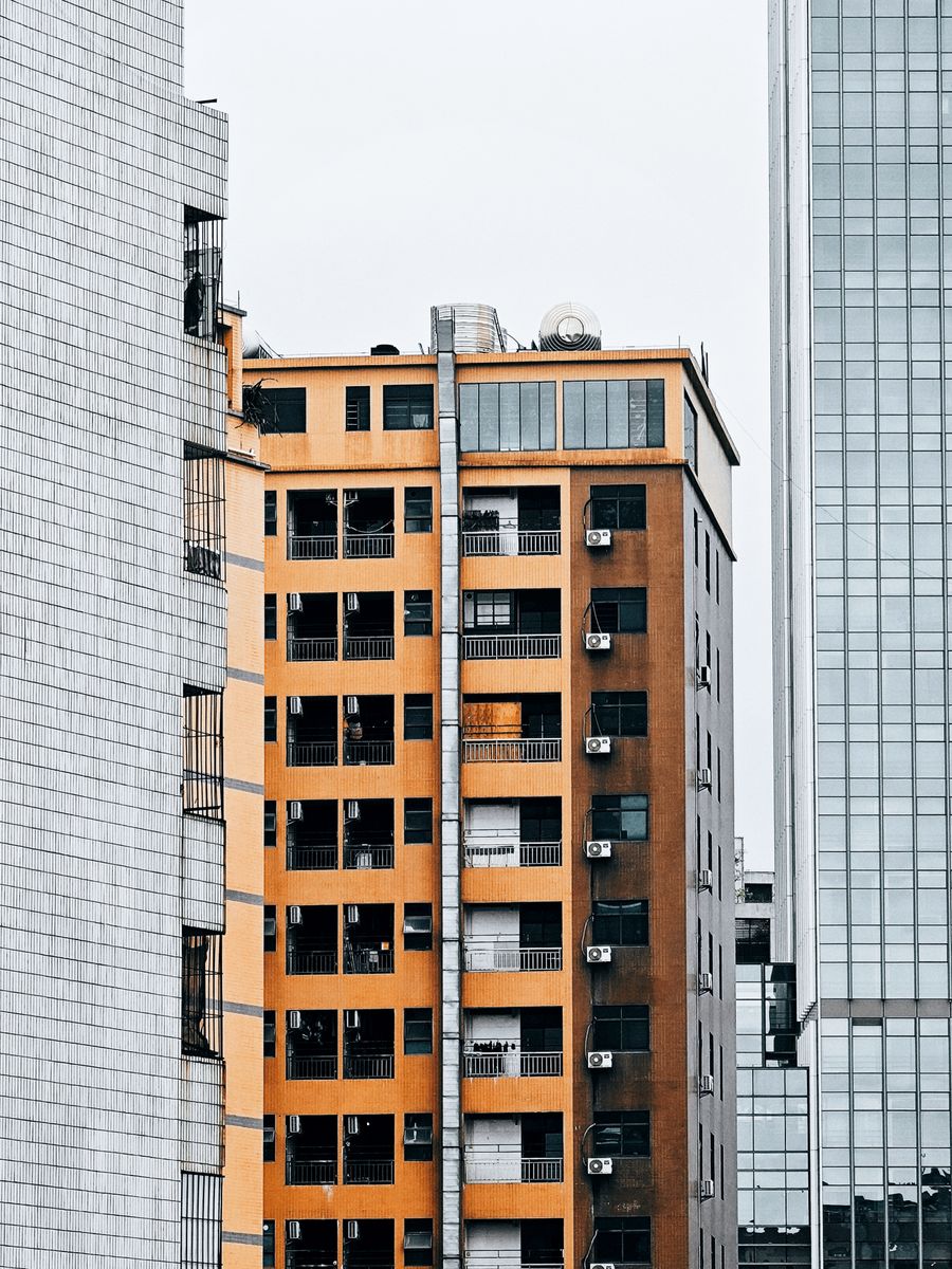 Close-up of an urban residential building exterior showcasing varied architectural elements and modern facade.
