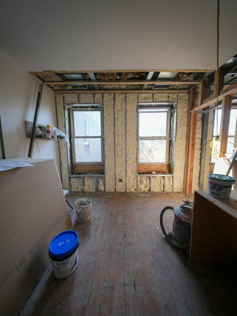 Room under construction with exposed walls and windows