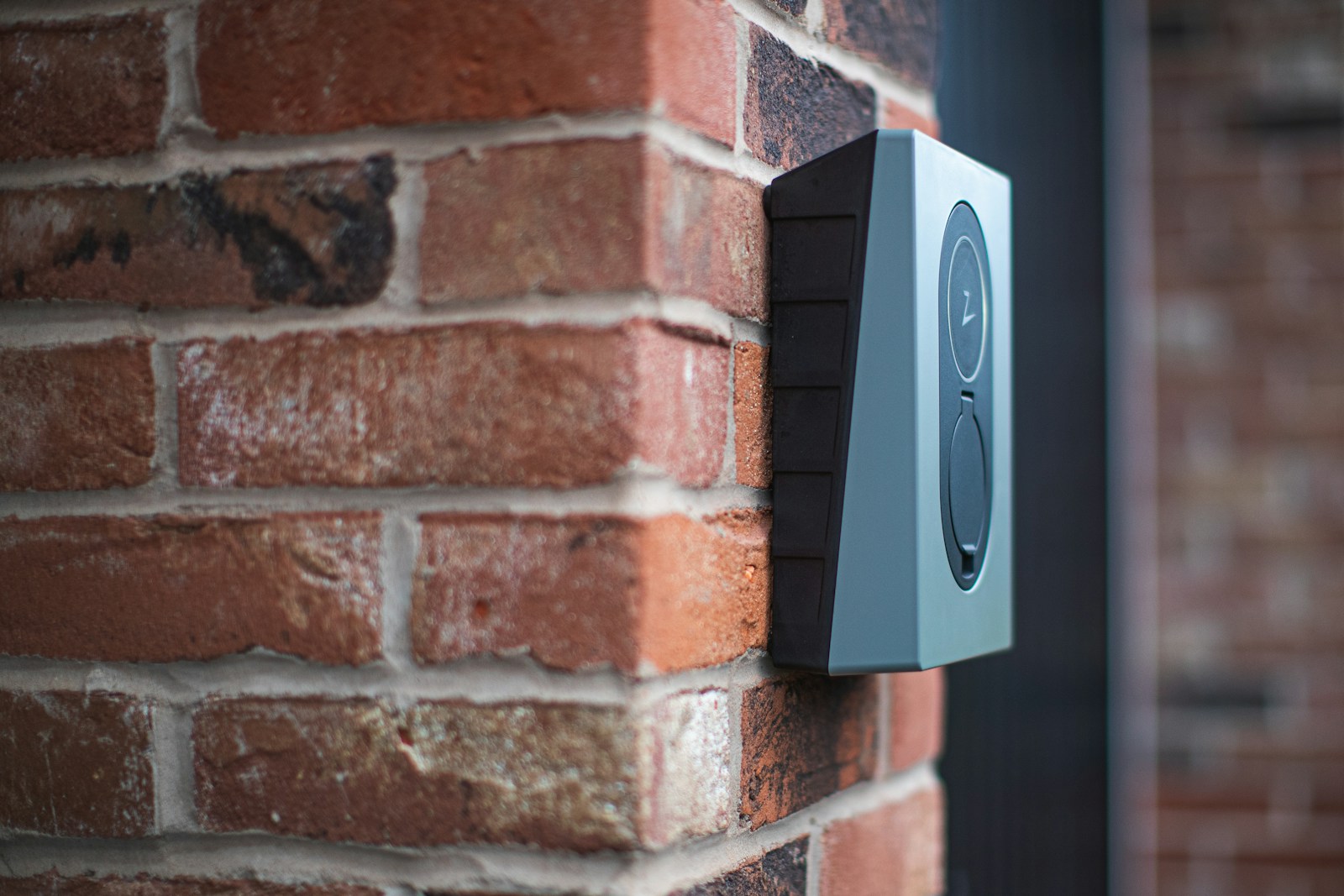 a close up of a brick wall with a speaker on it