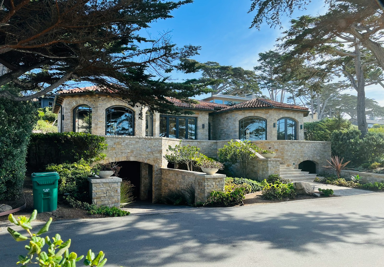 A large house with a lot of trees in front of it