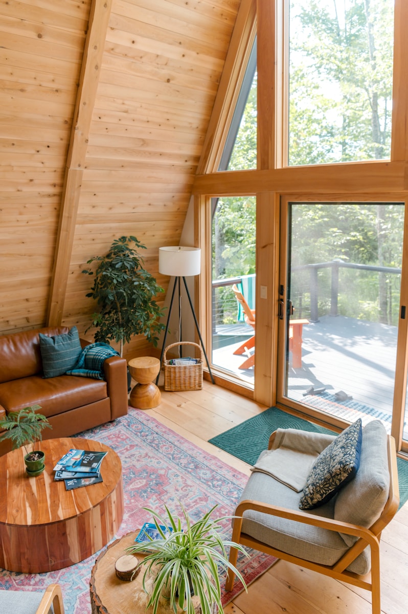 Cozy a-frame cabin living room with nature view
