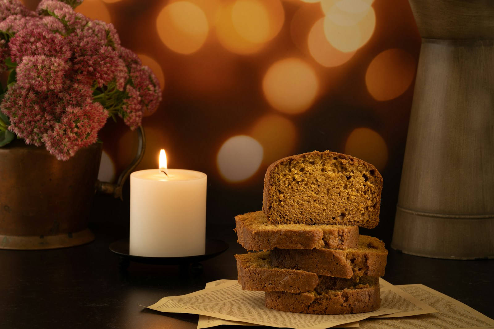 a candle next to a cake