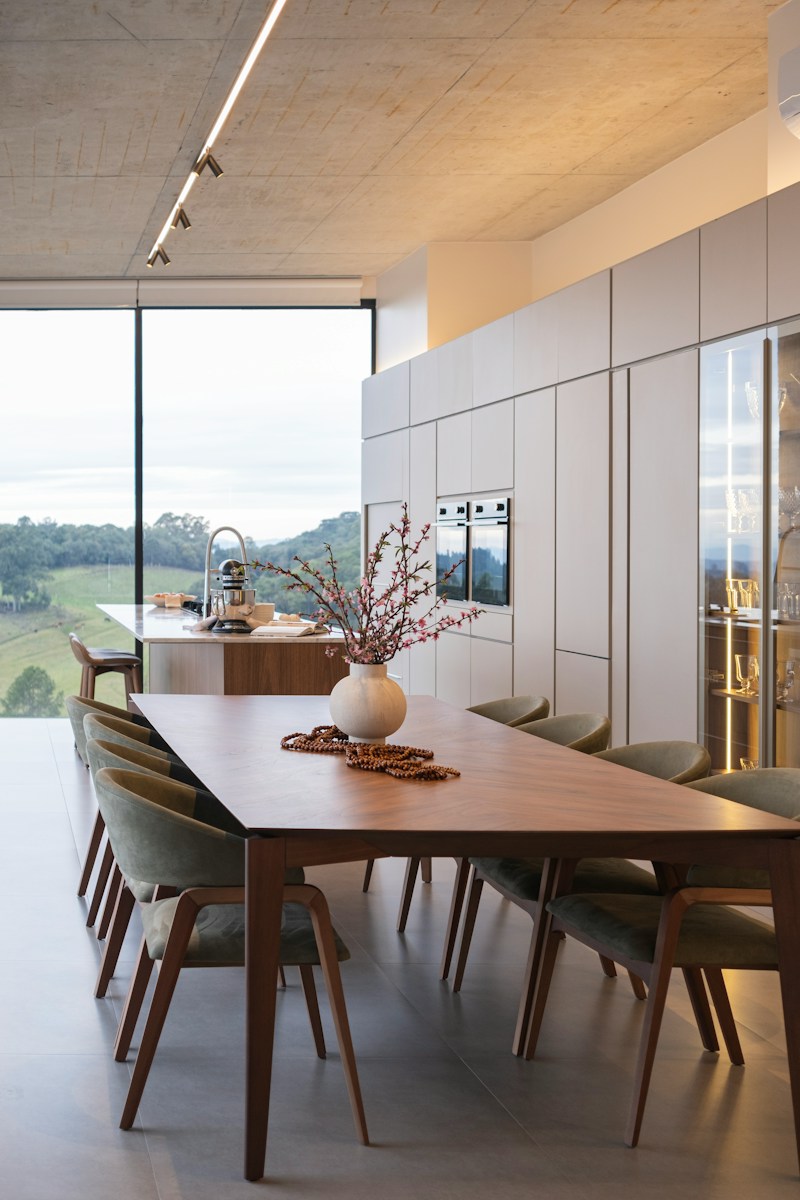 Modern dining room with large window and scenic view