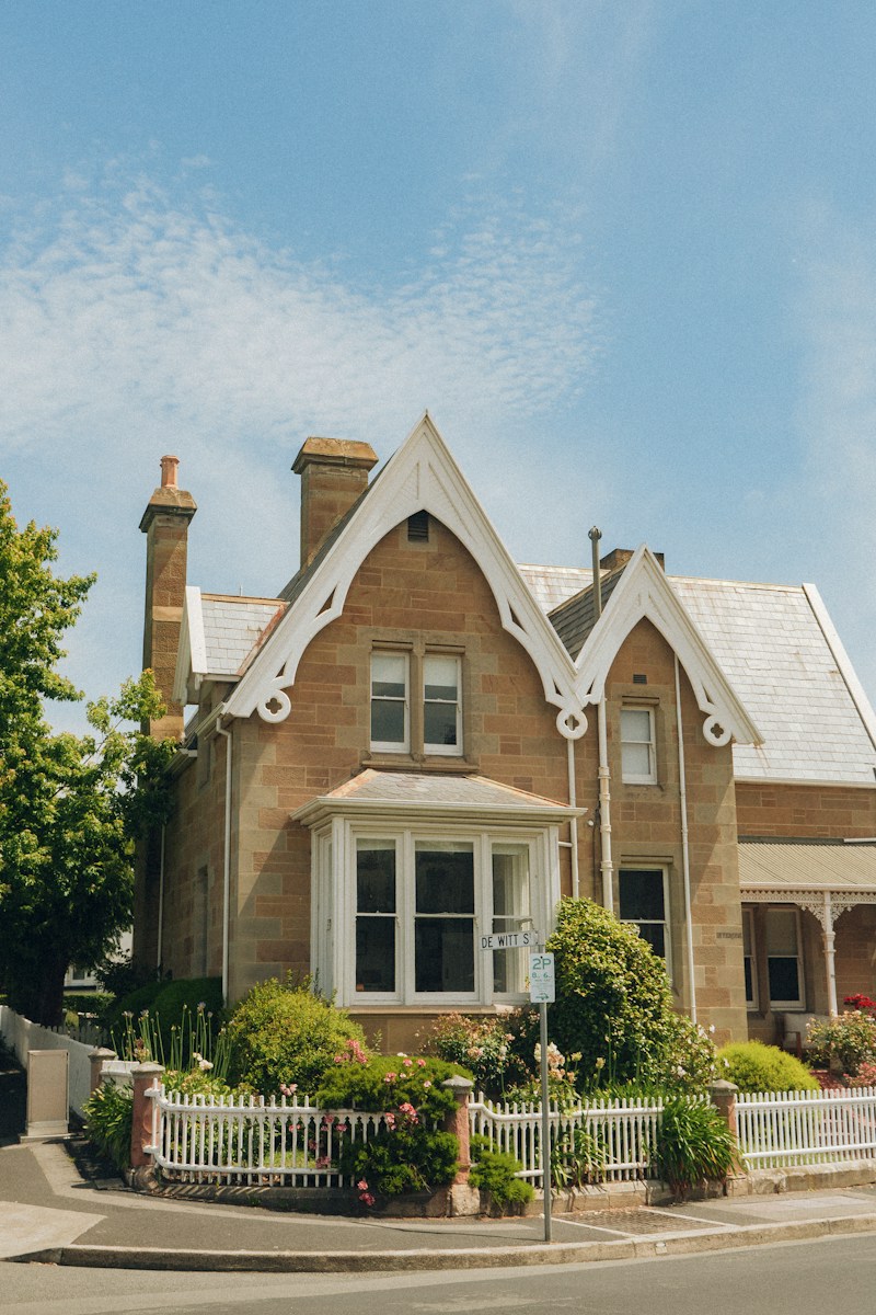 a house with a white picket fence in front of it