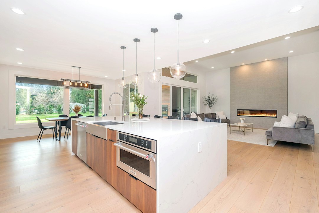 Open floor plan kitchen flowing into living room