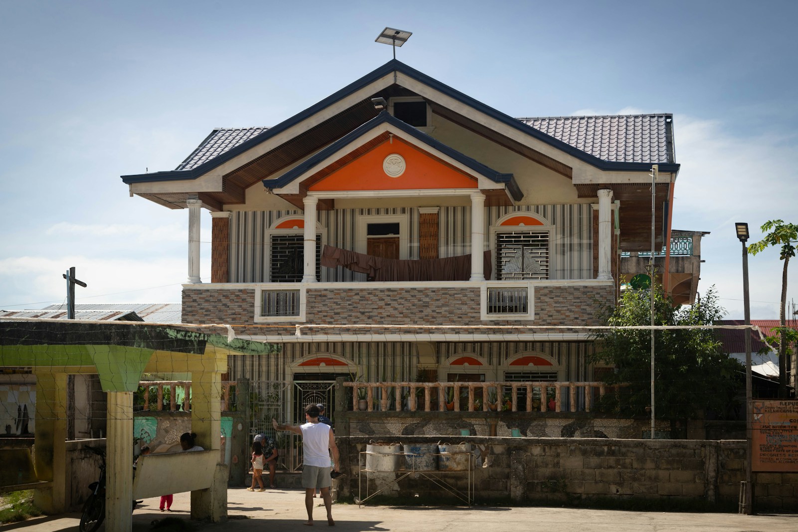 A two-story house with a unique architectural design