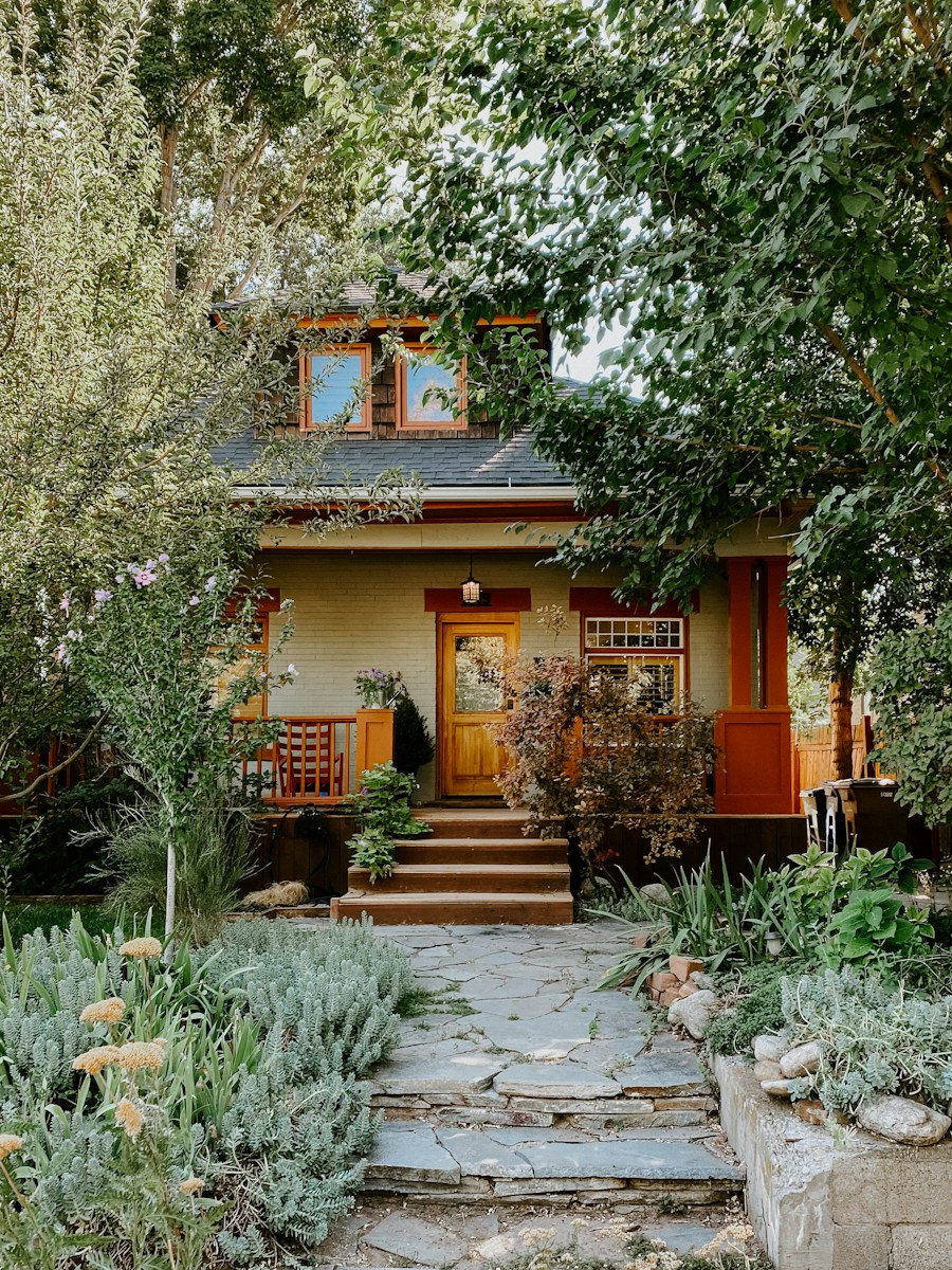 a house with a stone pathway leading to the front door